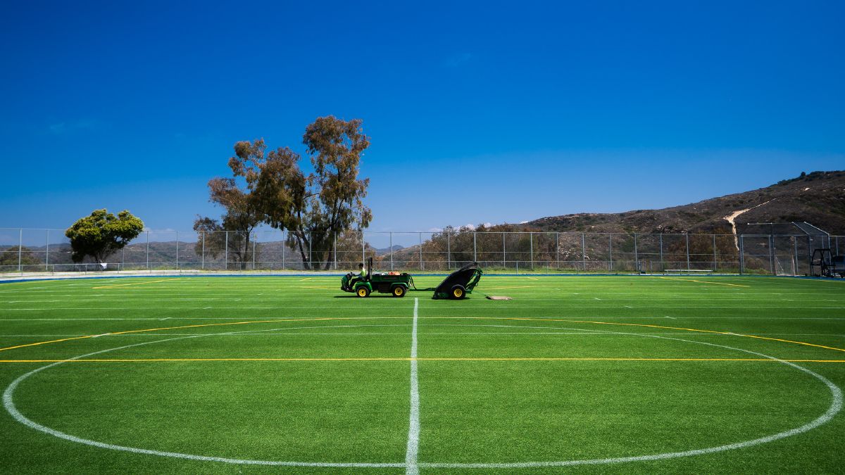 TurfSavior crew grooming a lined athletic field
